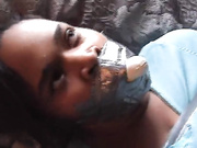 Ebony Synn Tape Bound And Gagged With Light Bulb