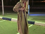 Blonde shopping with ropes under her coat