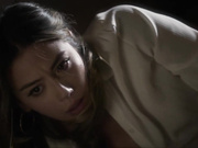 Chloe Bennet in handcuffs and leg irons